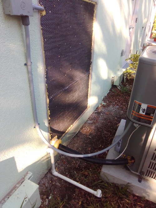 Photograph of the new central air conditioning system outside of the Wabasso site building.