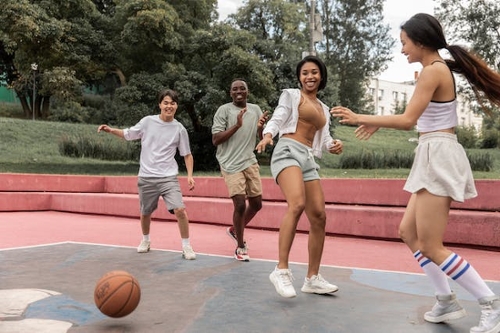Teenagers playing basketball